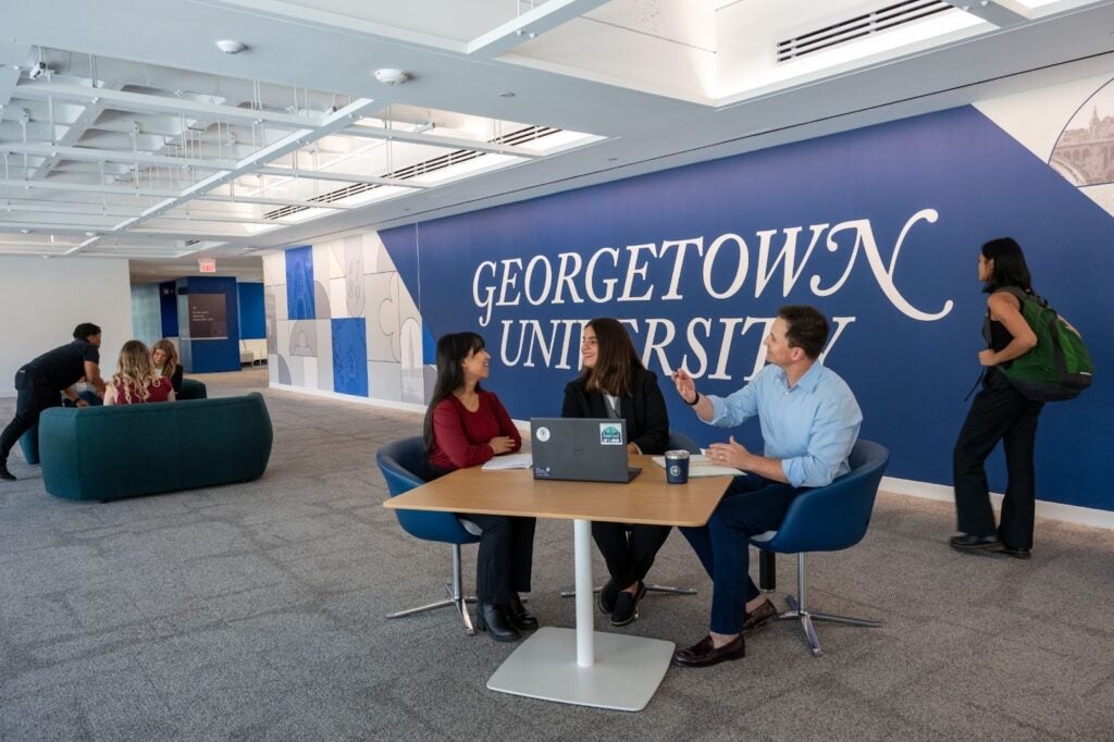 MSB students sitting at table and talking